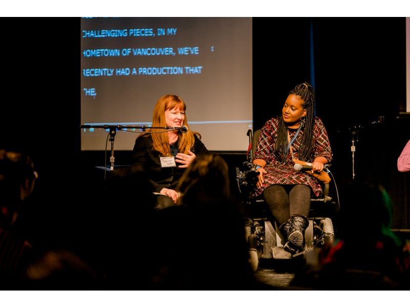 A photo of Kirsty Johnston and Sarah Jama on stage.